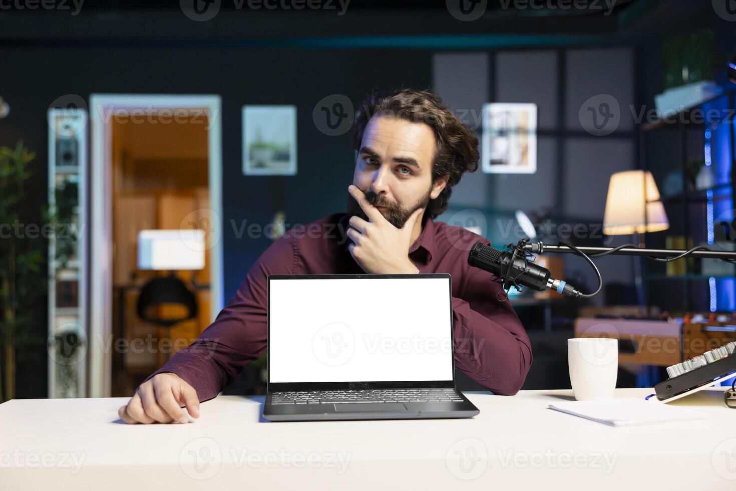 Entertainer presents mockup laptop, debating whether to recommend it to viewers or not. Content creator doing thinking hand gesturing, unsure of how to review isolated screen notebook photo