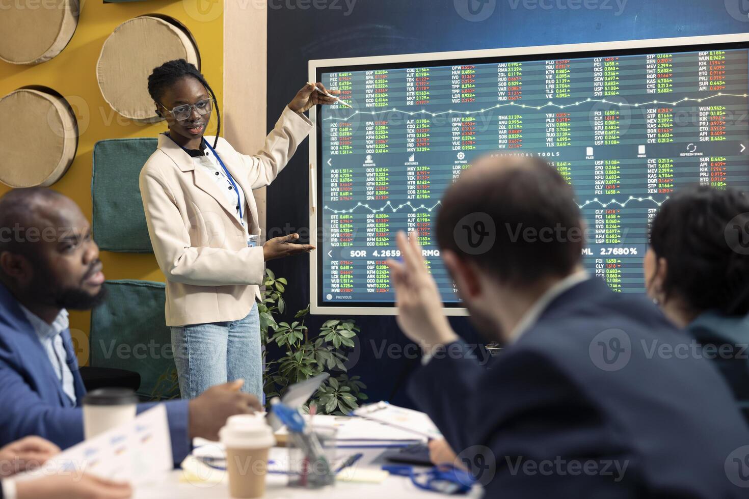 Sales management team examine global market trends in an informative meeting, increasing capital to start development projects. Business associates discuss global organization growth. photo