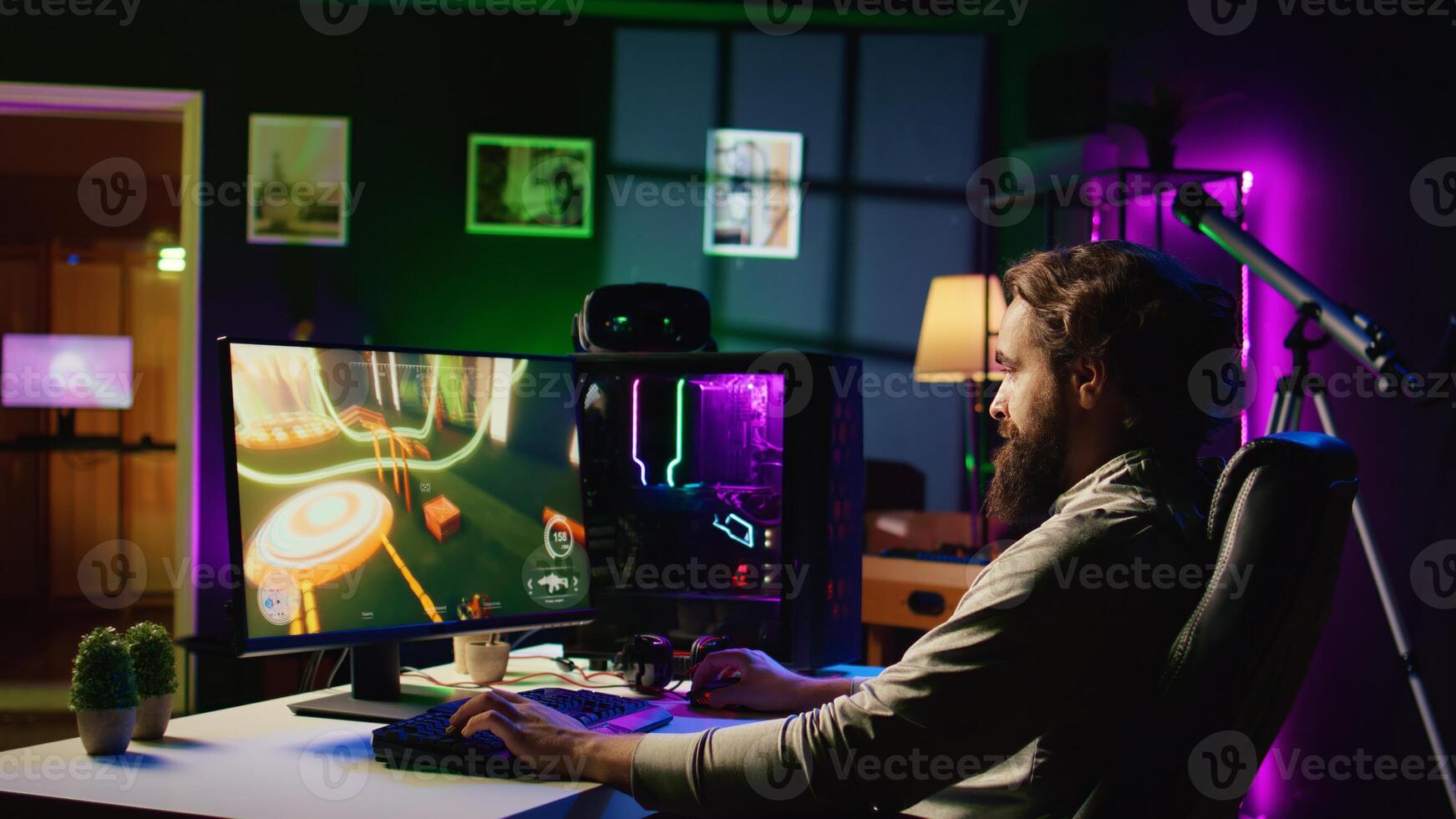Man in dark living room playing science fiction videogame on gaming PC, relaxing by shooting enemies. Gamer battling flying robots in online singleplayer shooter from rgb lights ornate house photo
