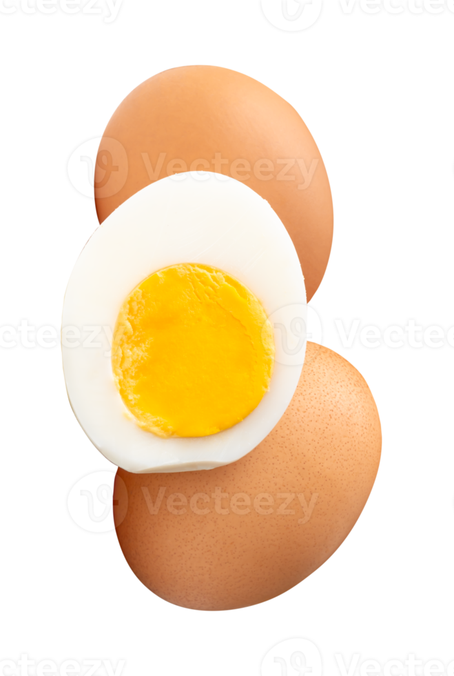 A vertical pile of two raw chicken eggs and peeled cooked or boiled egg with egg yolk in half in stack isolated with clipping path in file format png