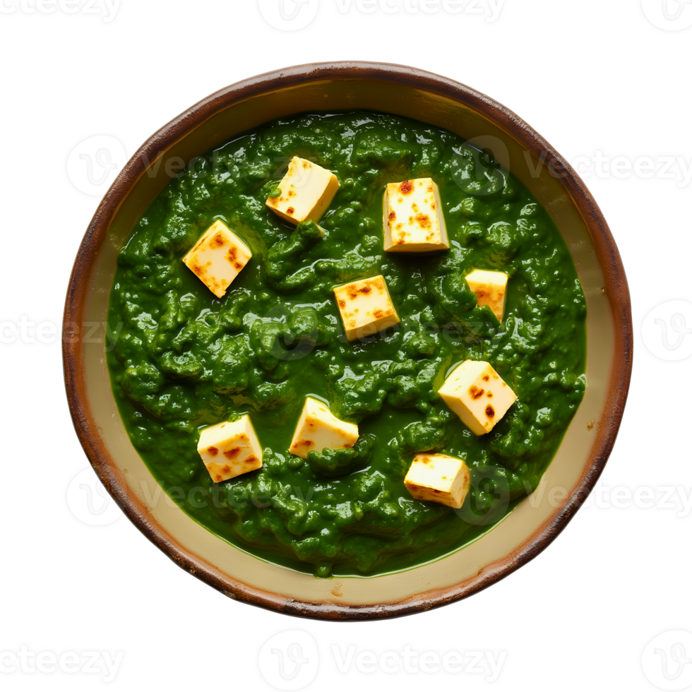 Spinach curry with cubes of cheese presented in a traditional bowl png