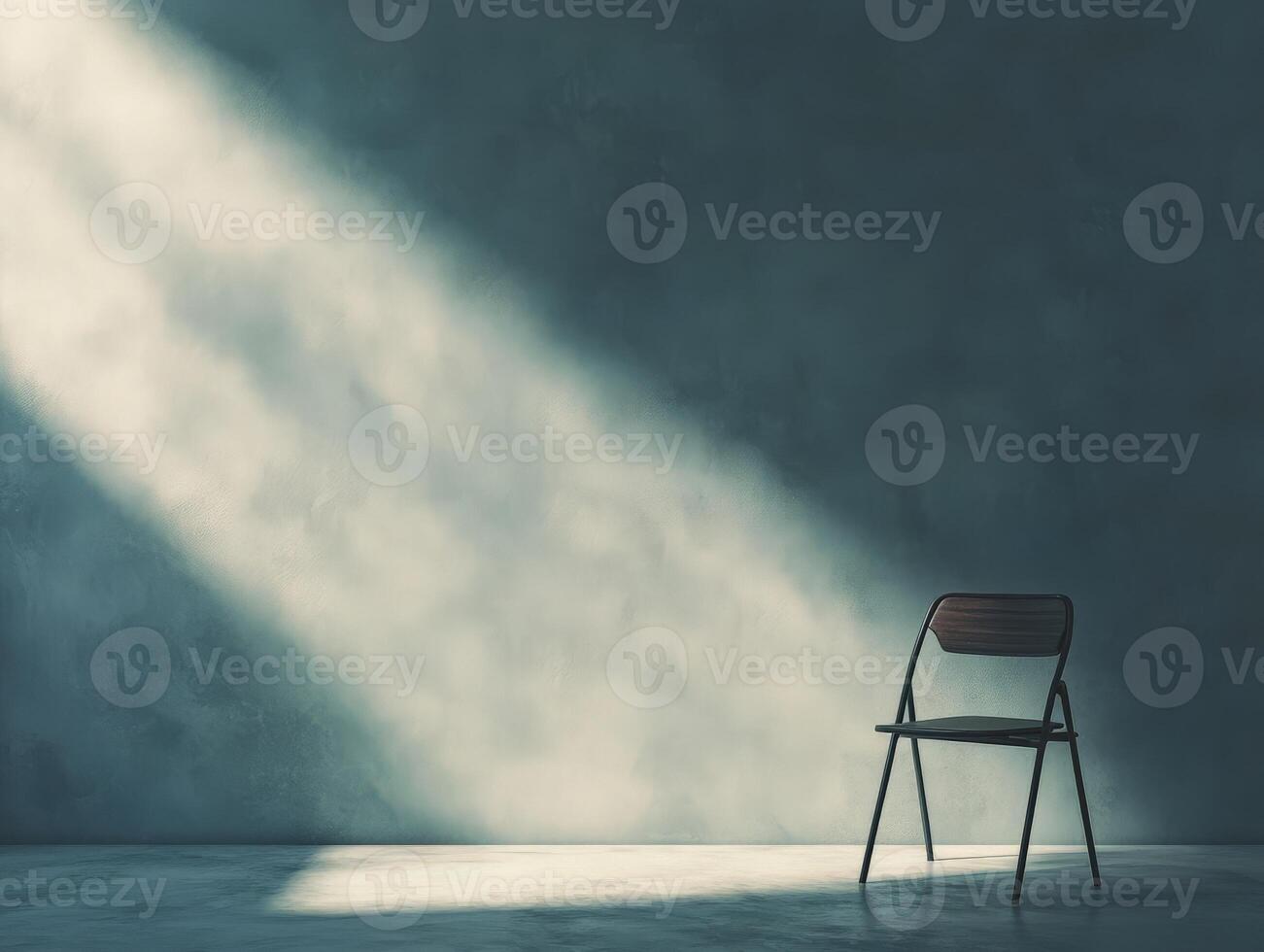 A solitary chair in a dimly lit space, creating a contemplative atmosphere. photo