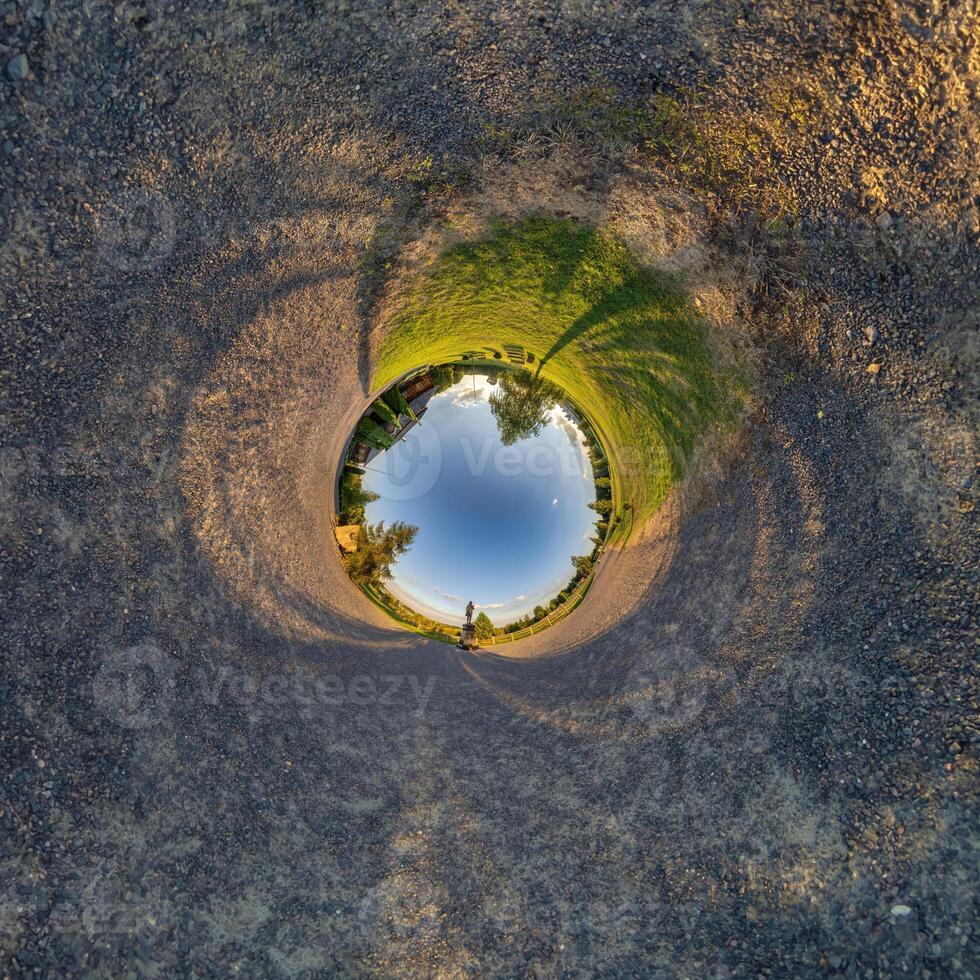 A circular view of a road and grass photo