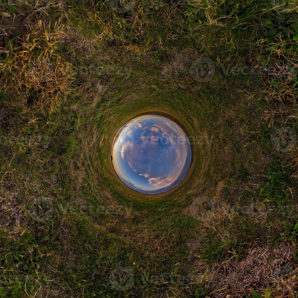 A view of the sky from inside a hole in the ground photo