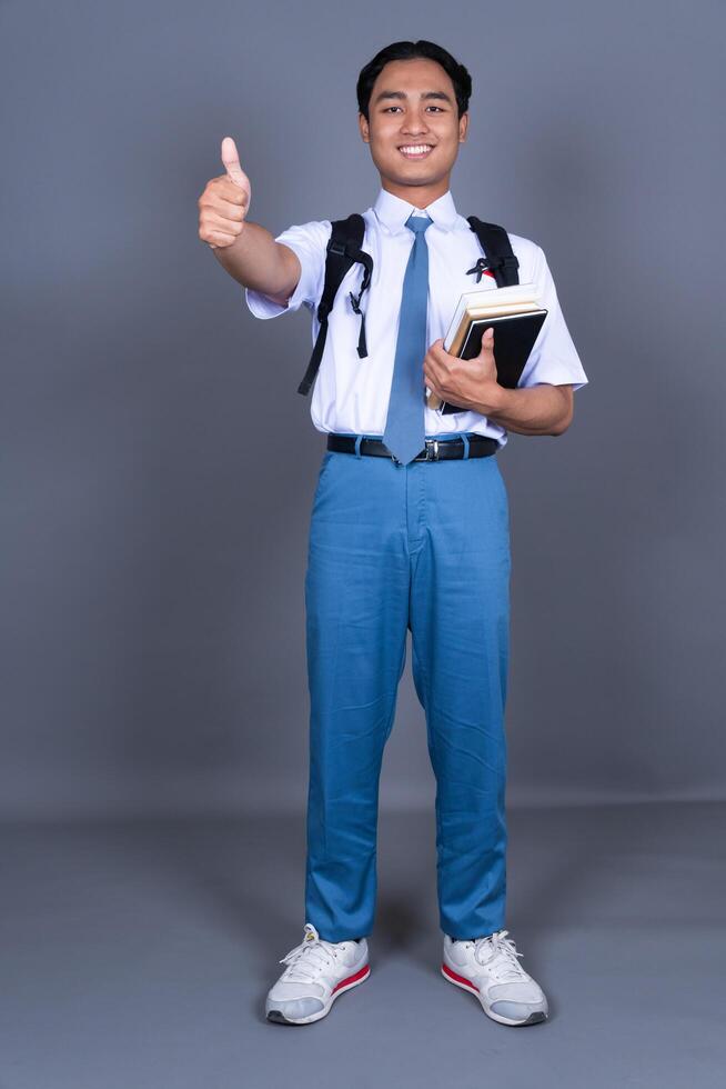 Full Body of Indonesian Male High School Students in Uniform photo