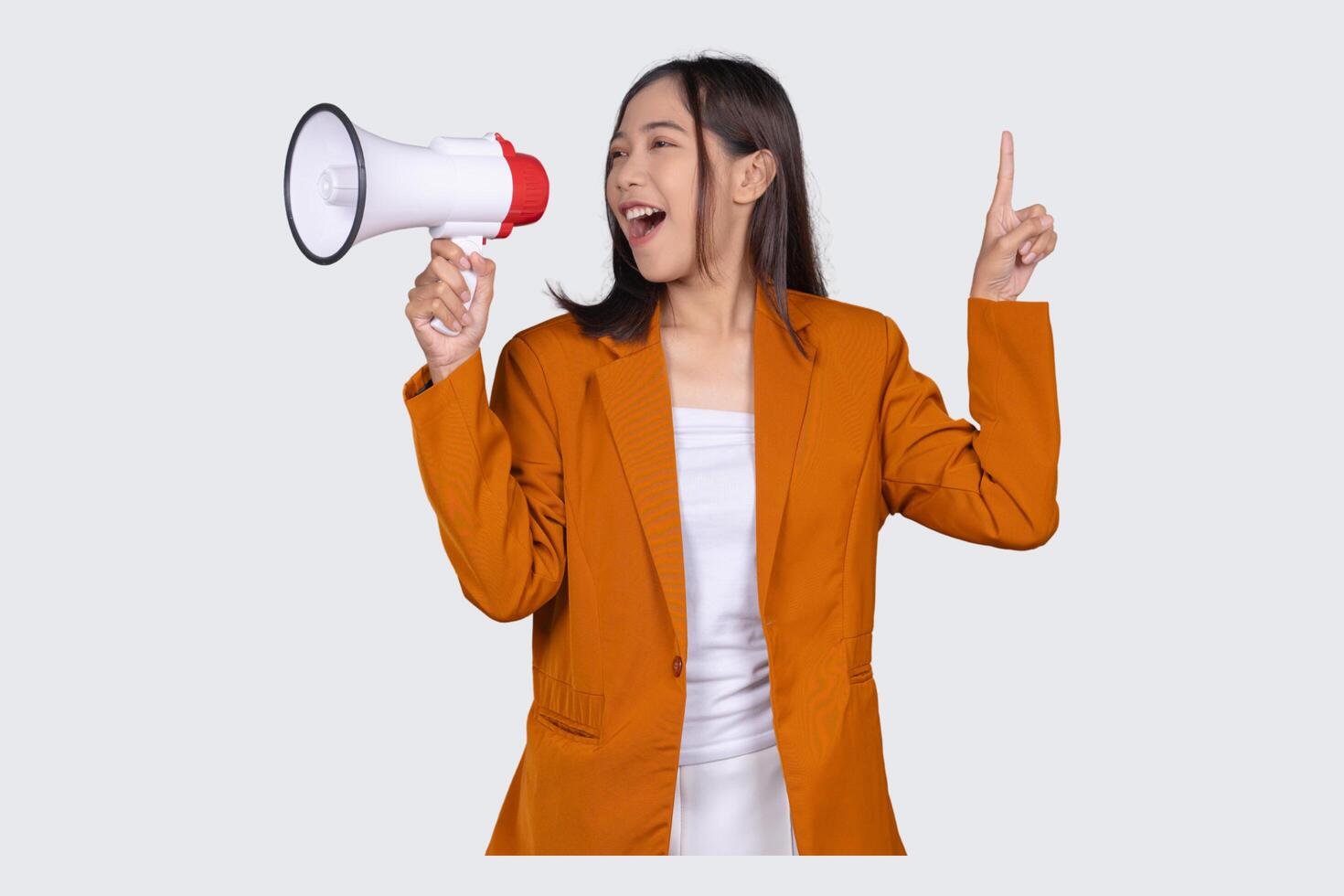 Portrait of Young Businesswoman with Megaphone Isolated Background photo