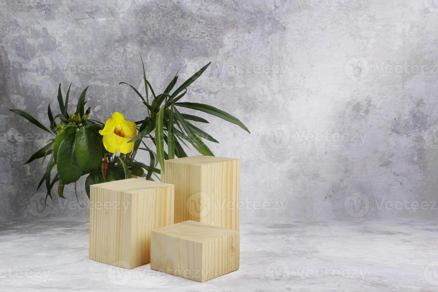 natural wooden block with leaves and a flower photo