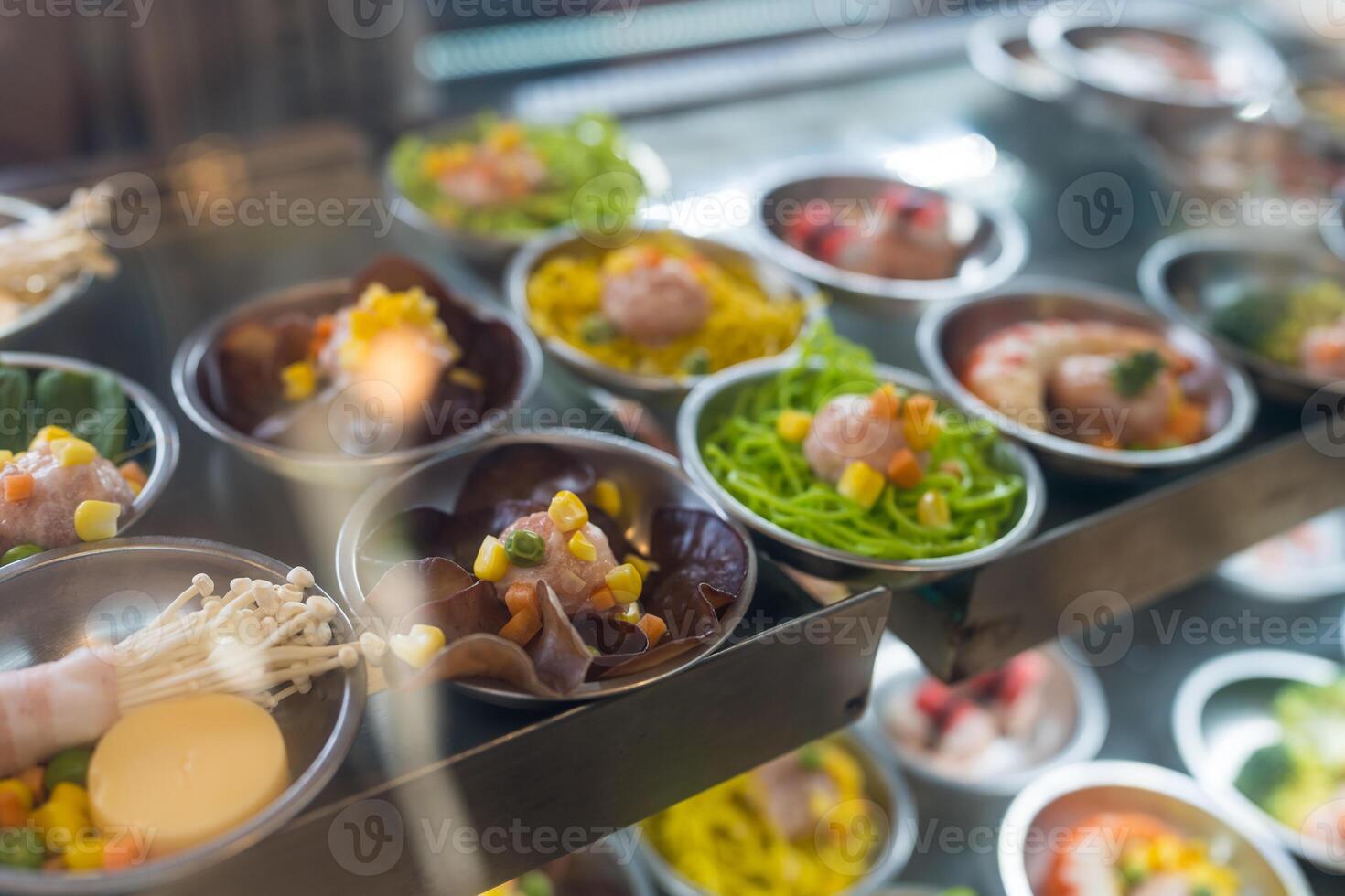 Many kind of dim sum in showcase at restaurant. photo