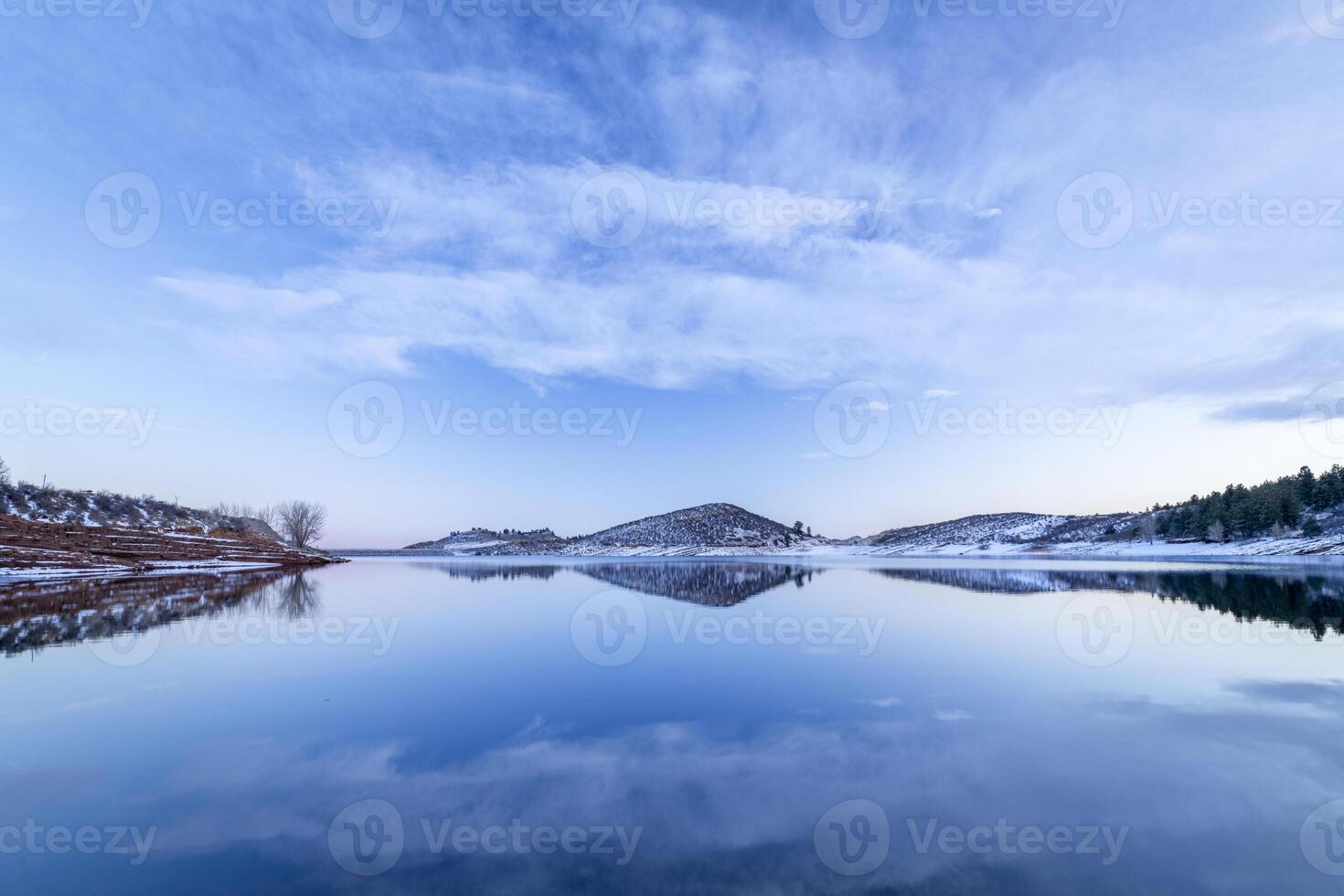 calm winter dusk over Horsetooth Reservoir in foothills of Rocky Mountains in Colorado photo