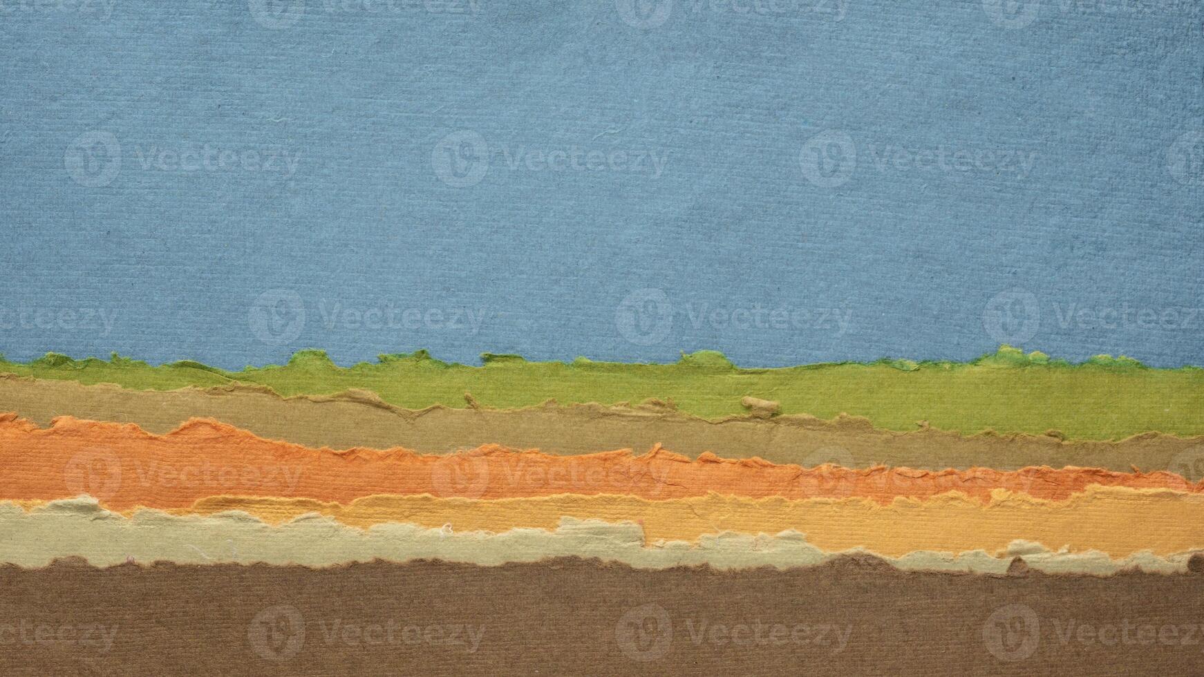 blue sky over hills abstract landscape created with handmade paper photo