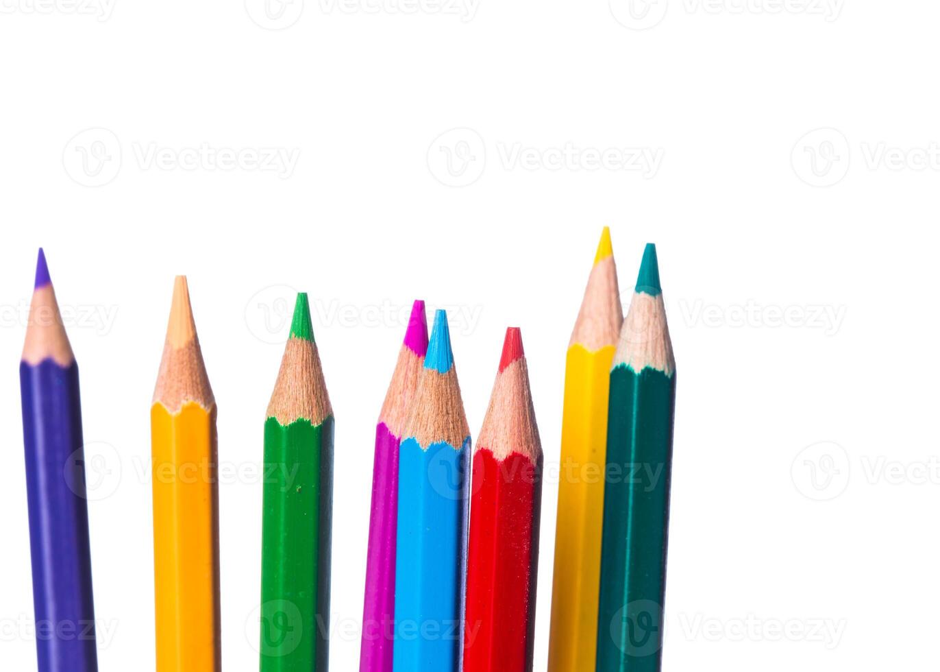 Colorful collection of sharpened pencils arranged on a white background for creative projects photo