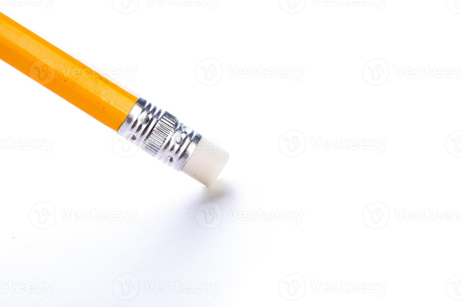 Pencil with eraser resting on a white surface highlighting simplicity and creativity in writing photo