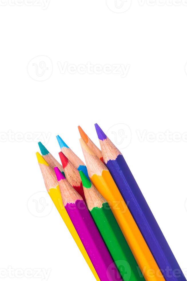 Vibrant colored pencils clustered together on a plain background ready for creative drawing and art projects photo