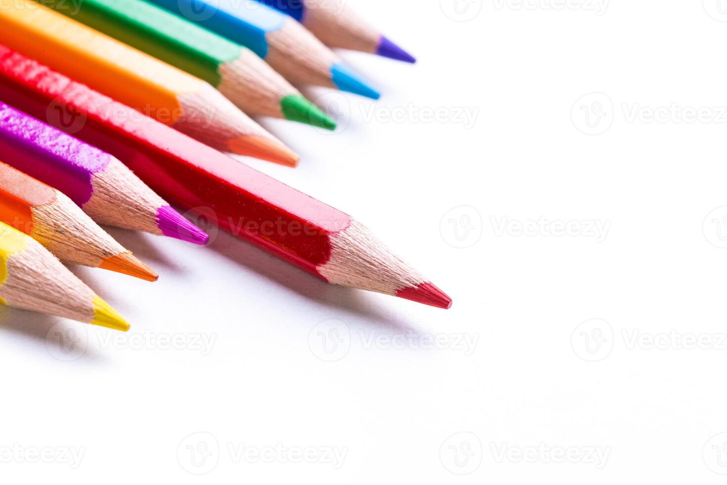 Vibrant colored pencils arranged in a row on a clean surface ready for art and creativity photo