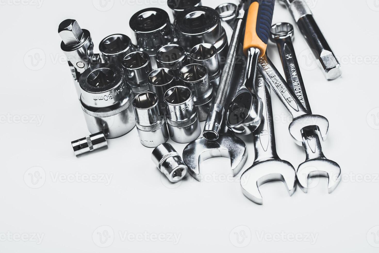 Tools arranged neatly on a light surface showcasing various types for mechanical and repair work photo