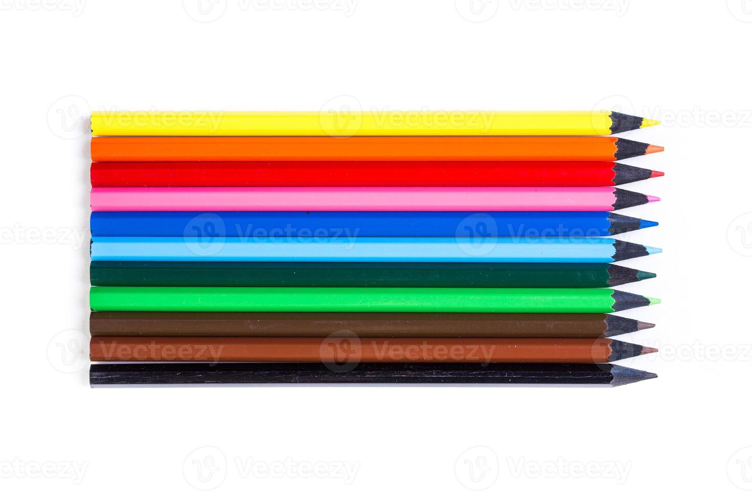 Collection of colorful pencils arranged in a row on a white background for creative projects and art activities photo