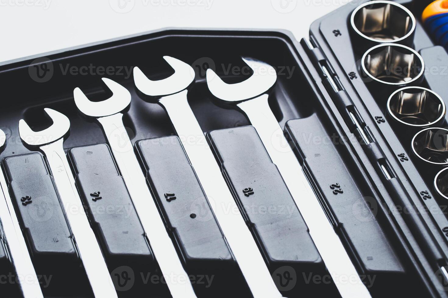 High-quality set of wrenches organized in a compact tool box for mechanics and DIY enthusiasts photo