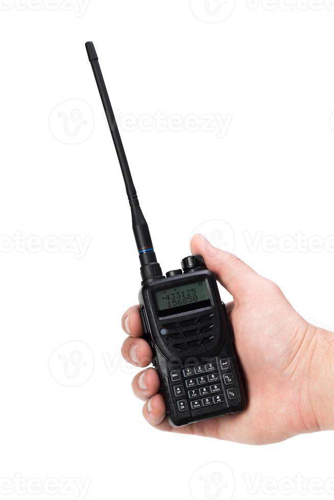 Handheld communication device being held by an individual in a casual setting during daylight photo