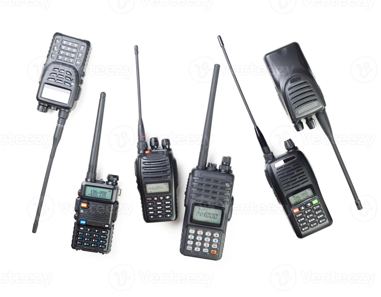 Multiple handheld radios arranged on a white background showcasing various designs and features photo