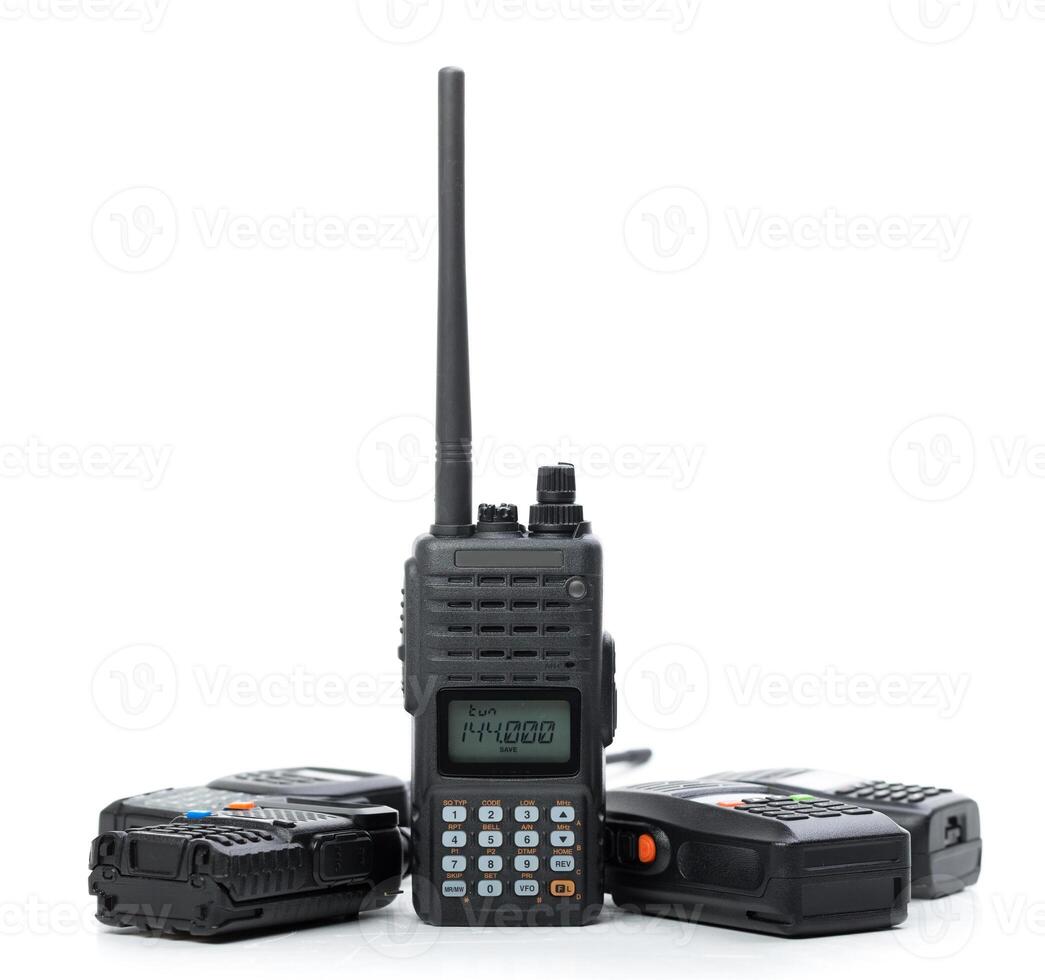 Various walkie talkies arranged in a group displaying different designs and features on a white background photo
