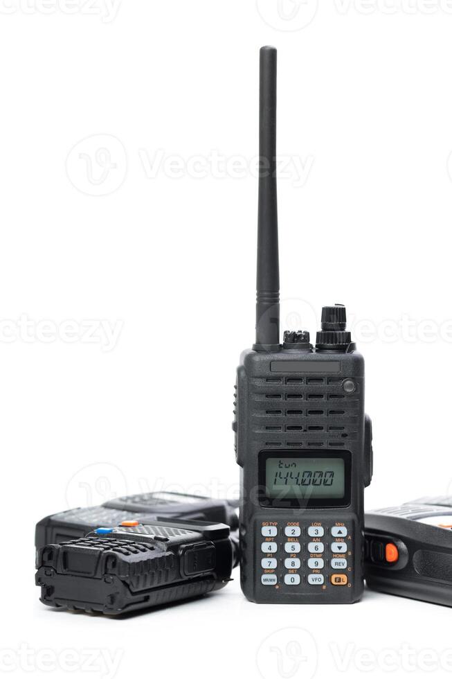 Portable two-way radio with antenna and battery pack positioned for communication use during outdoor activities photo