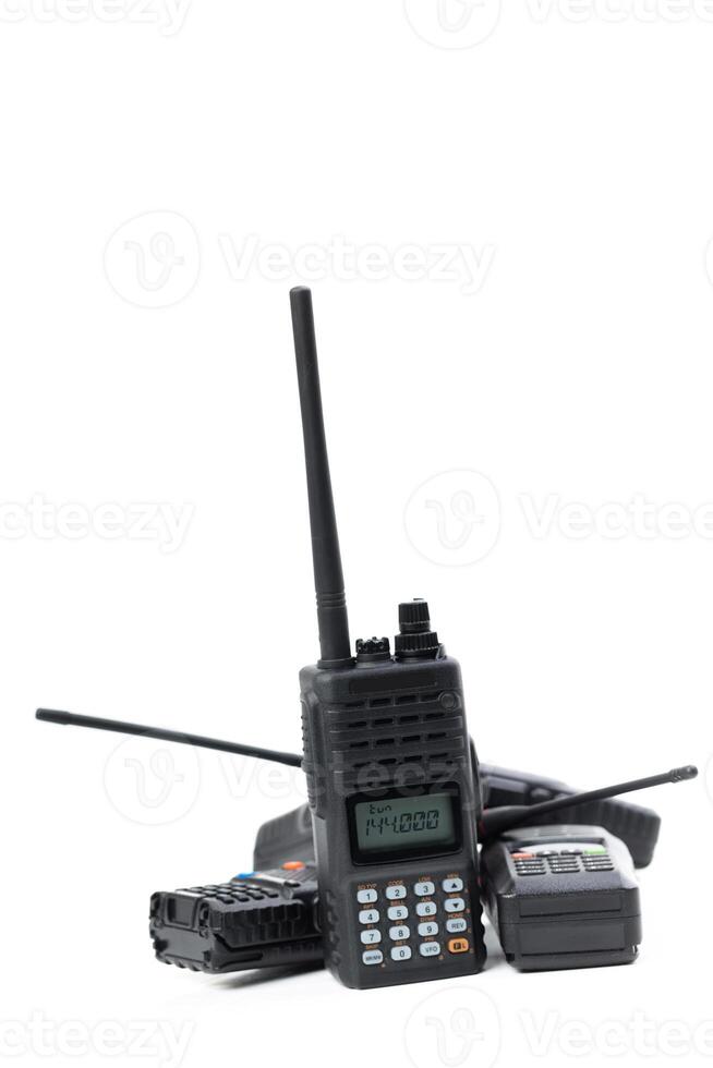 Multiple handheld radios stacked together on a white background showcasing their features and design details photo