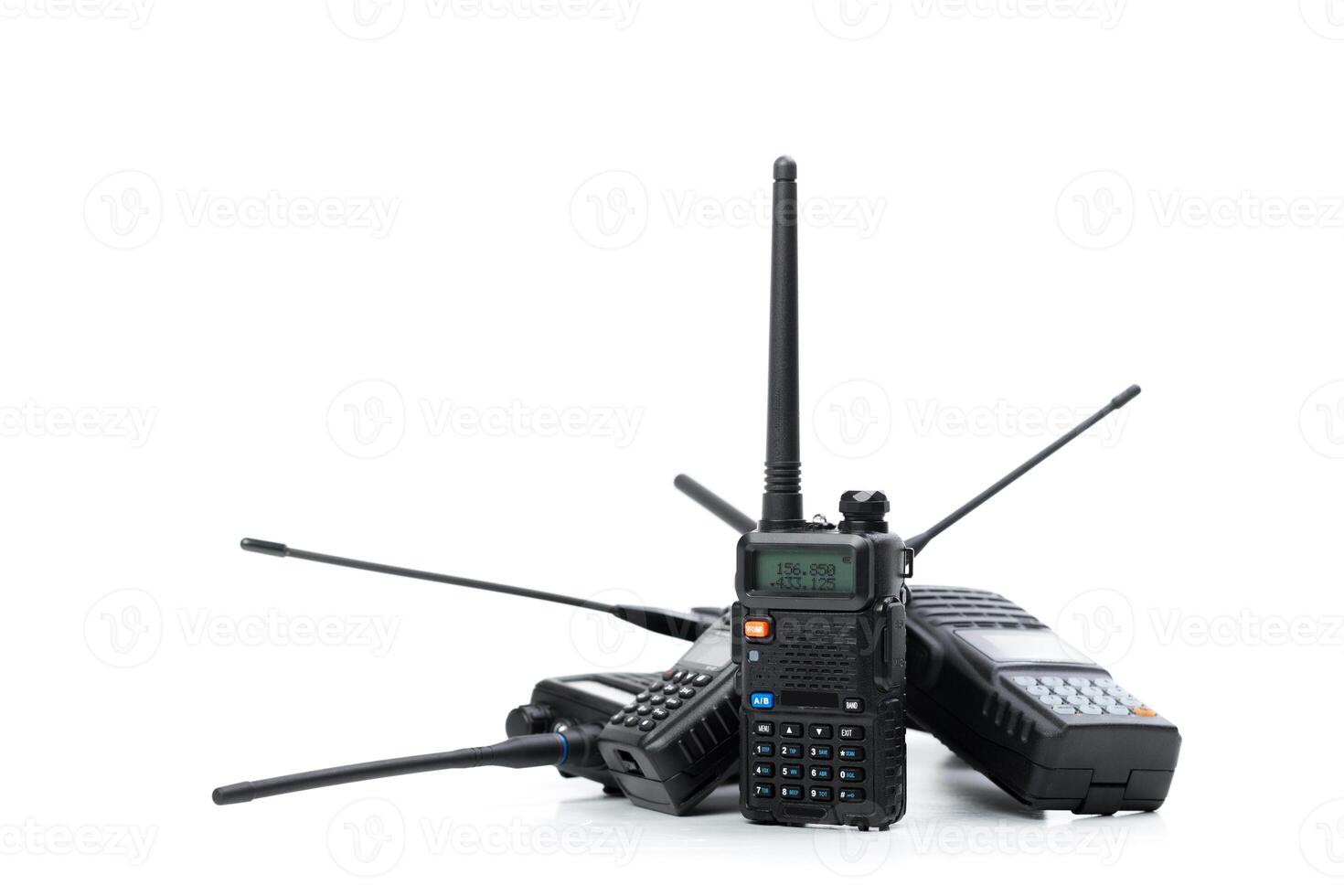 Multiple handheld radios arranged together in a creative display showcasing communication technology photo