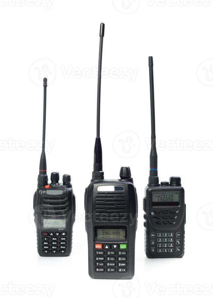 Different models of two-way radios arranged in a row showcasing various designs and sizes for communication purposes photo