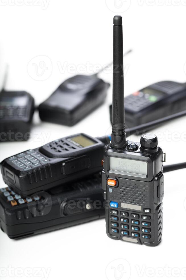 Modern communication tools on display with various handheld radios in different sizes and designs photo
