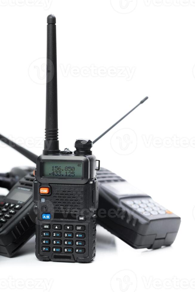Multiple handheld radios displayed on a white background showcasing their features and designs photo
