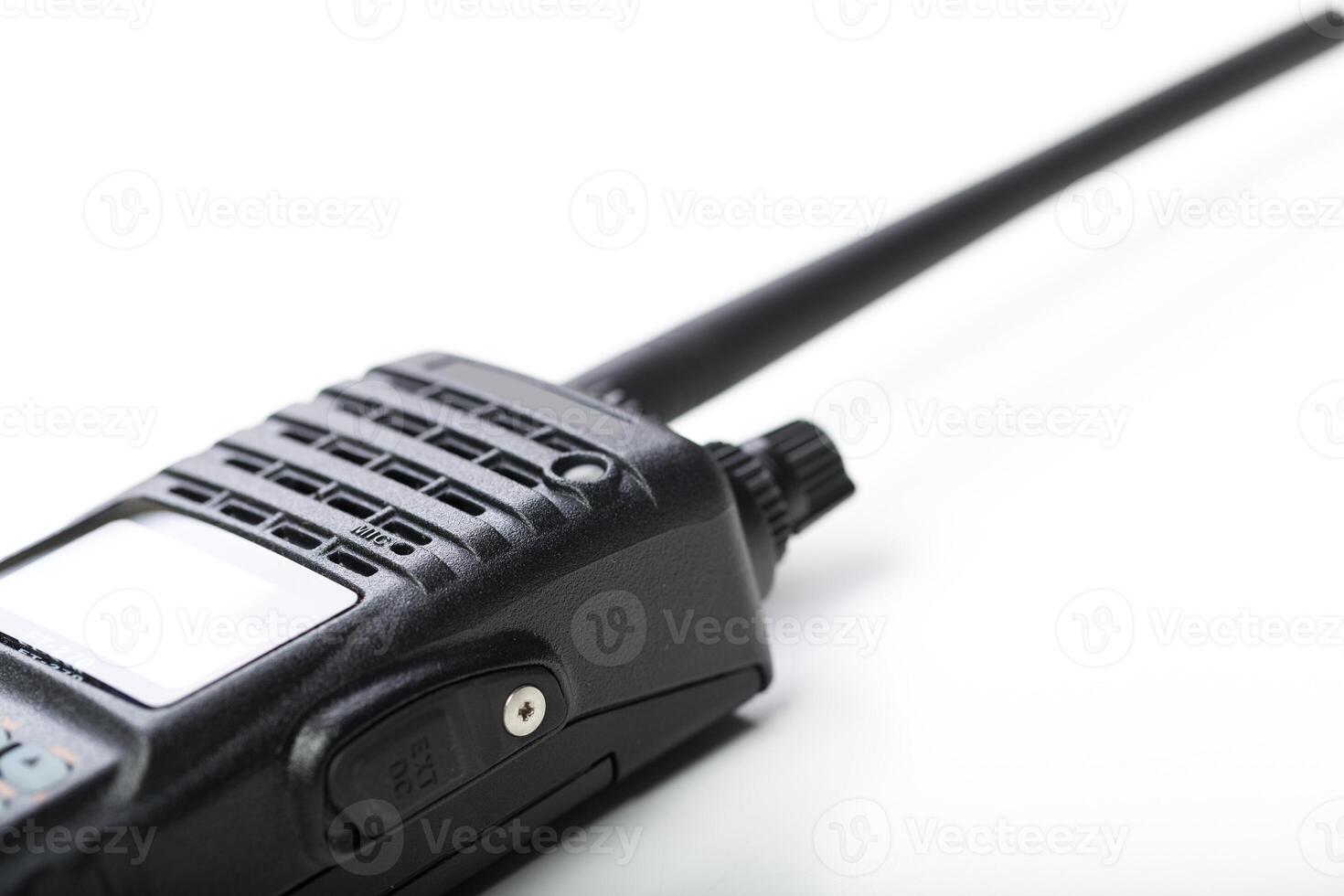 Communication device is placed on a white surface with a long antenna during a quiet moment photo