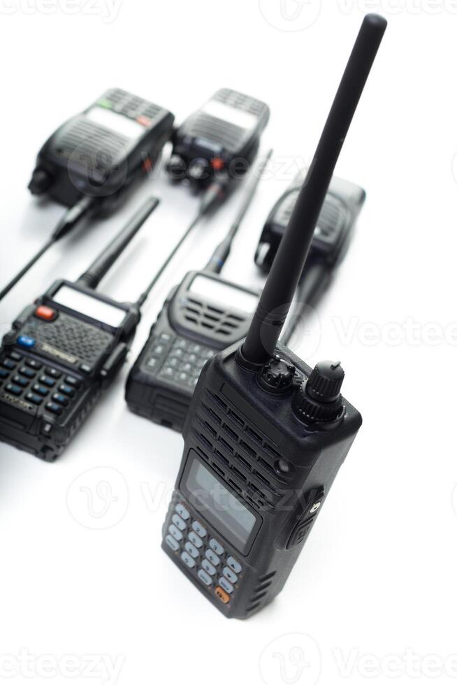 Various handheld radios displayed on a white background highlighting communication devices for professional use photo