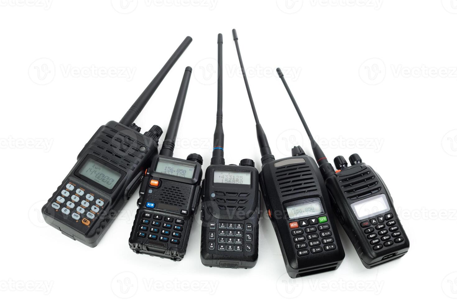Various communication devices arranged in a row with different designs and features for reliable radio transmission photo