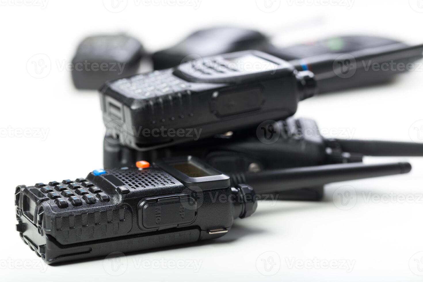 Collection of handheld communication devices primarily used for outdoor activities and emergency situations in a neutral setting photo