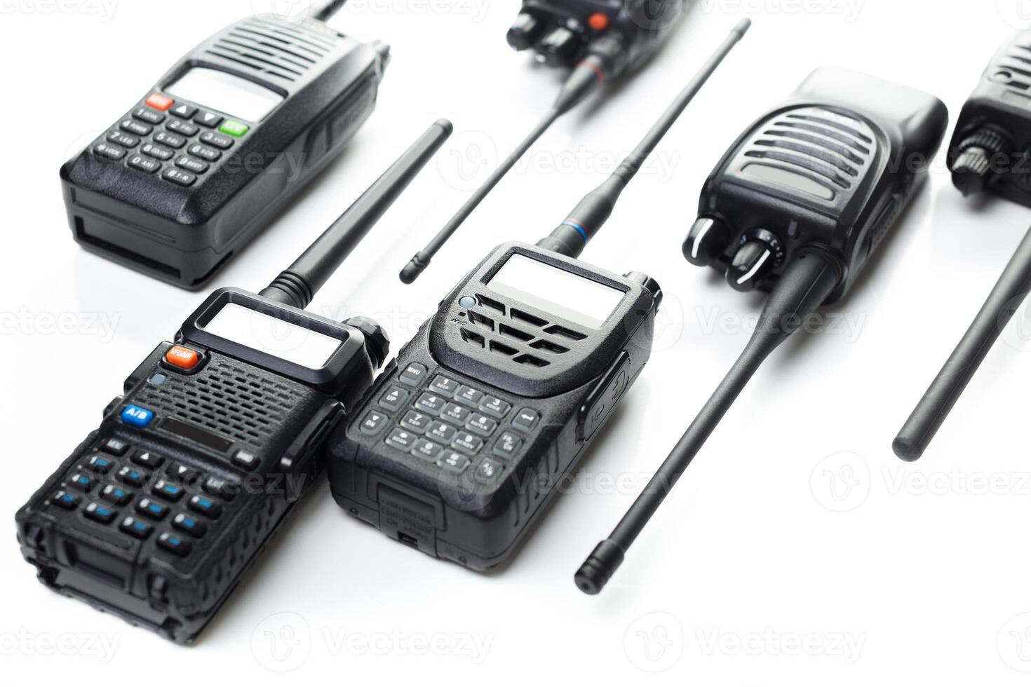 Various models of two-way radios displayed on a white background for communication technology enthusiasts photo