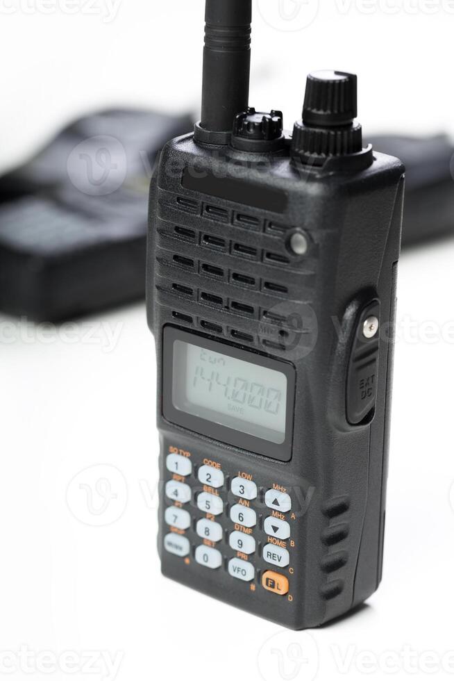 Handheld communication device used for radio transmissions in various settings and activities photo
