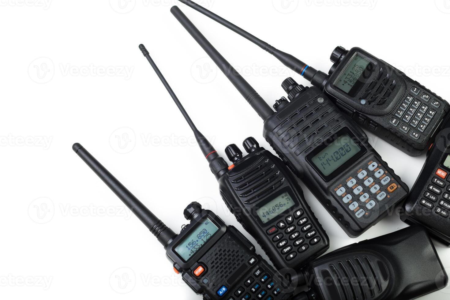 Collection of handheld walkie-talkies arranged on a white background showcasing various models and features photo