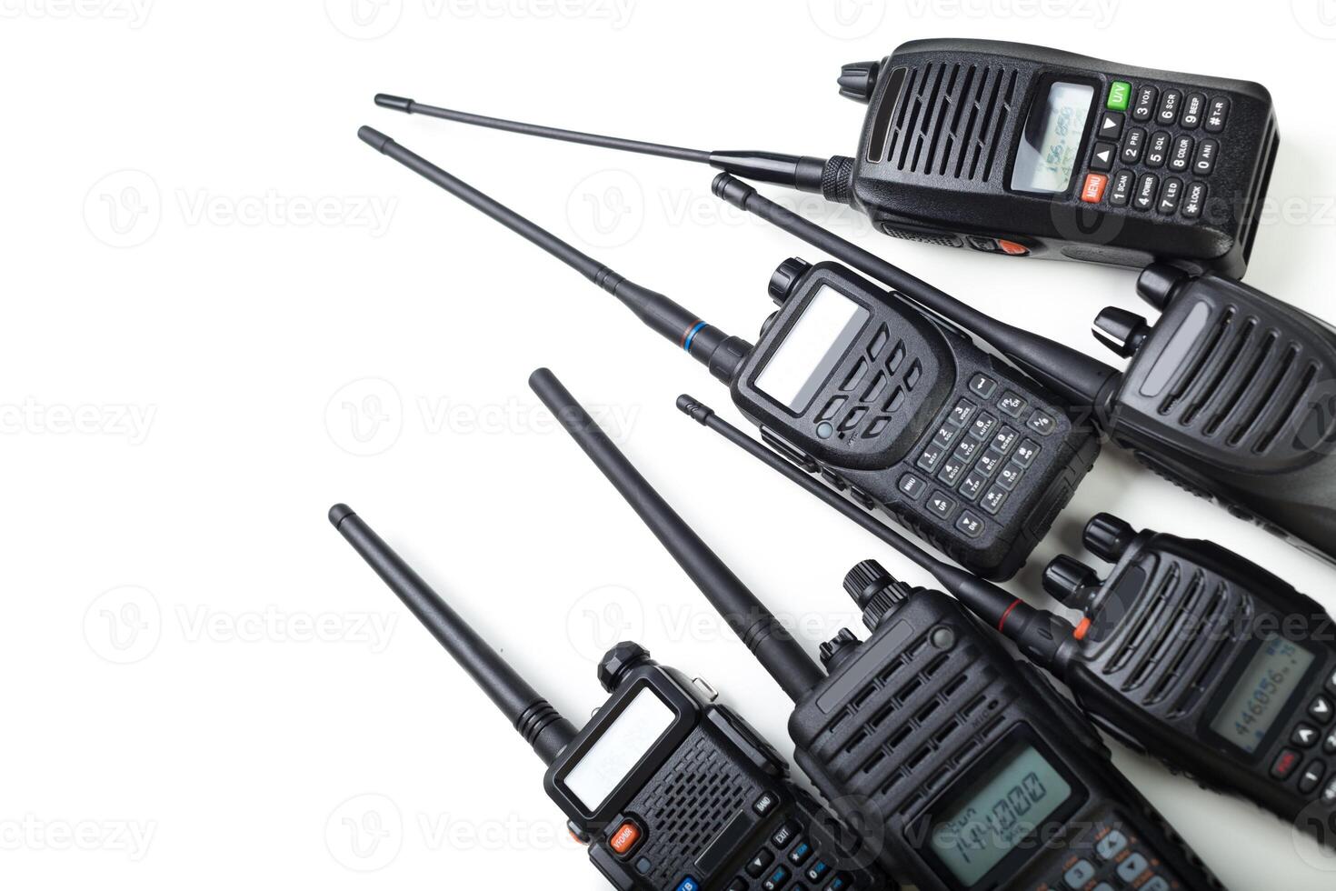 Collection of two-way radios displayed on a white background showcasing various designs and functions photo
