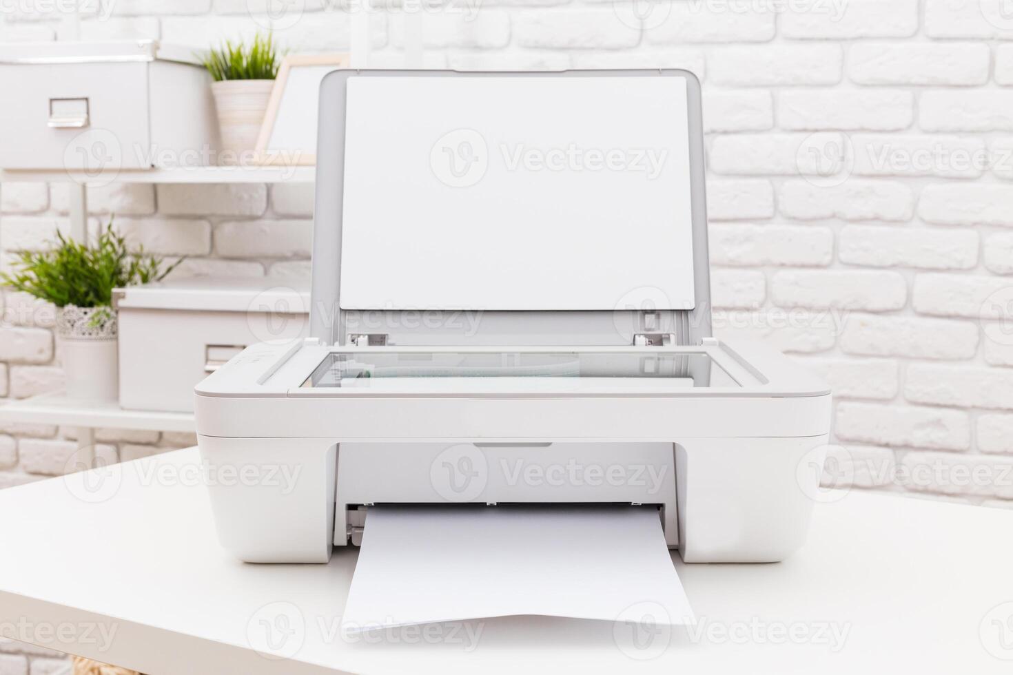 Printer situated on a desk printing a blank document in a bright and minimalist workspace photo