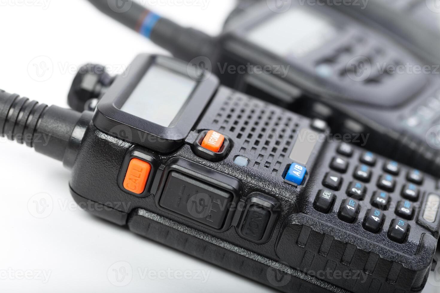 Handheld communication devices on a white background showcasing intricate details and functionalities for effective operation in various settings photo