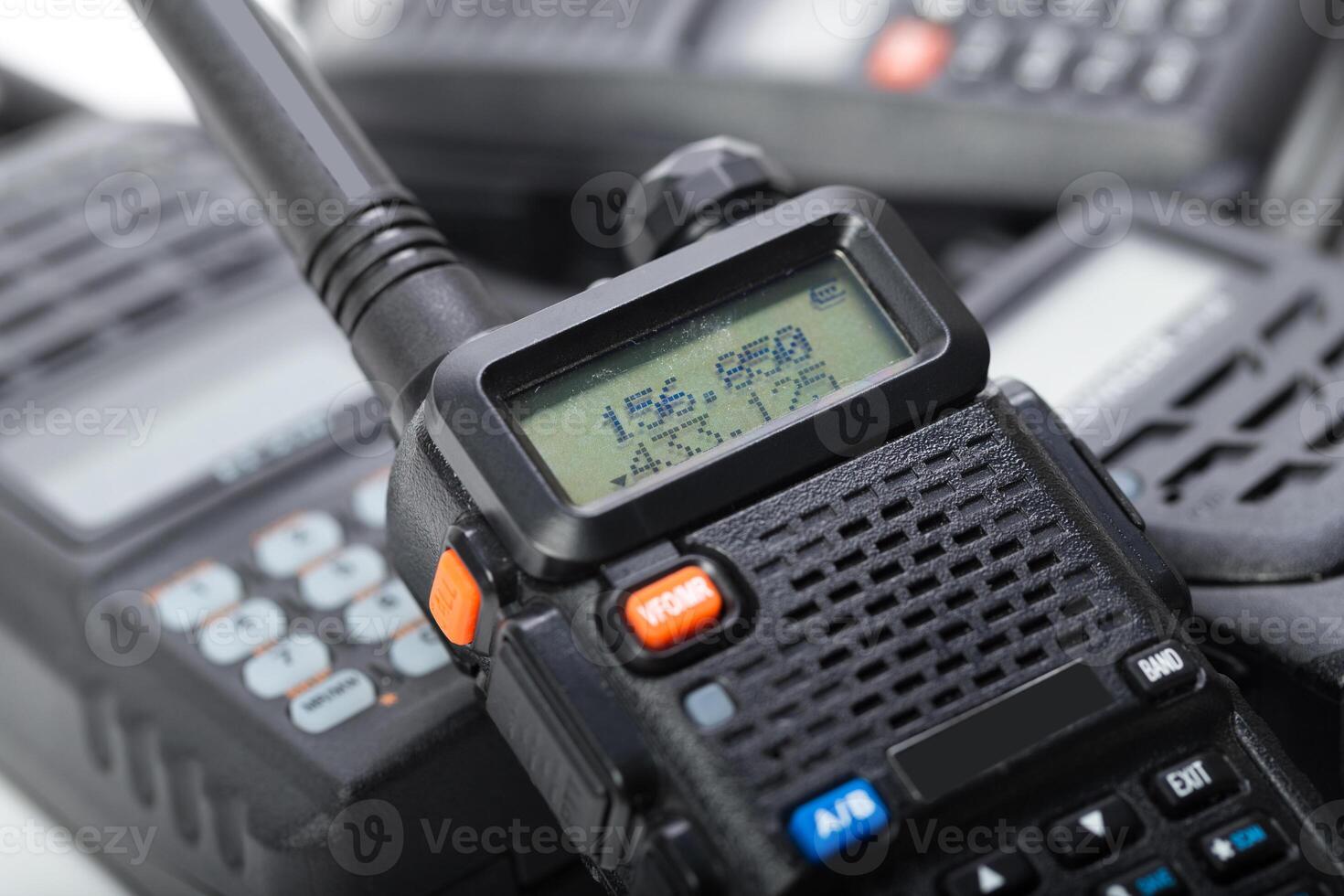 Handheld communication devices displayed on a surface in a professional environment during daylight hours photo
