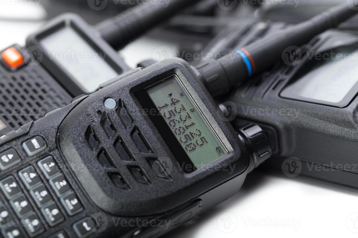 Various types of communication devices arranged close together on a surface for inspection and use photo