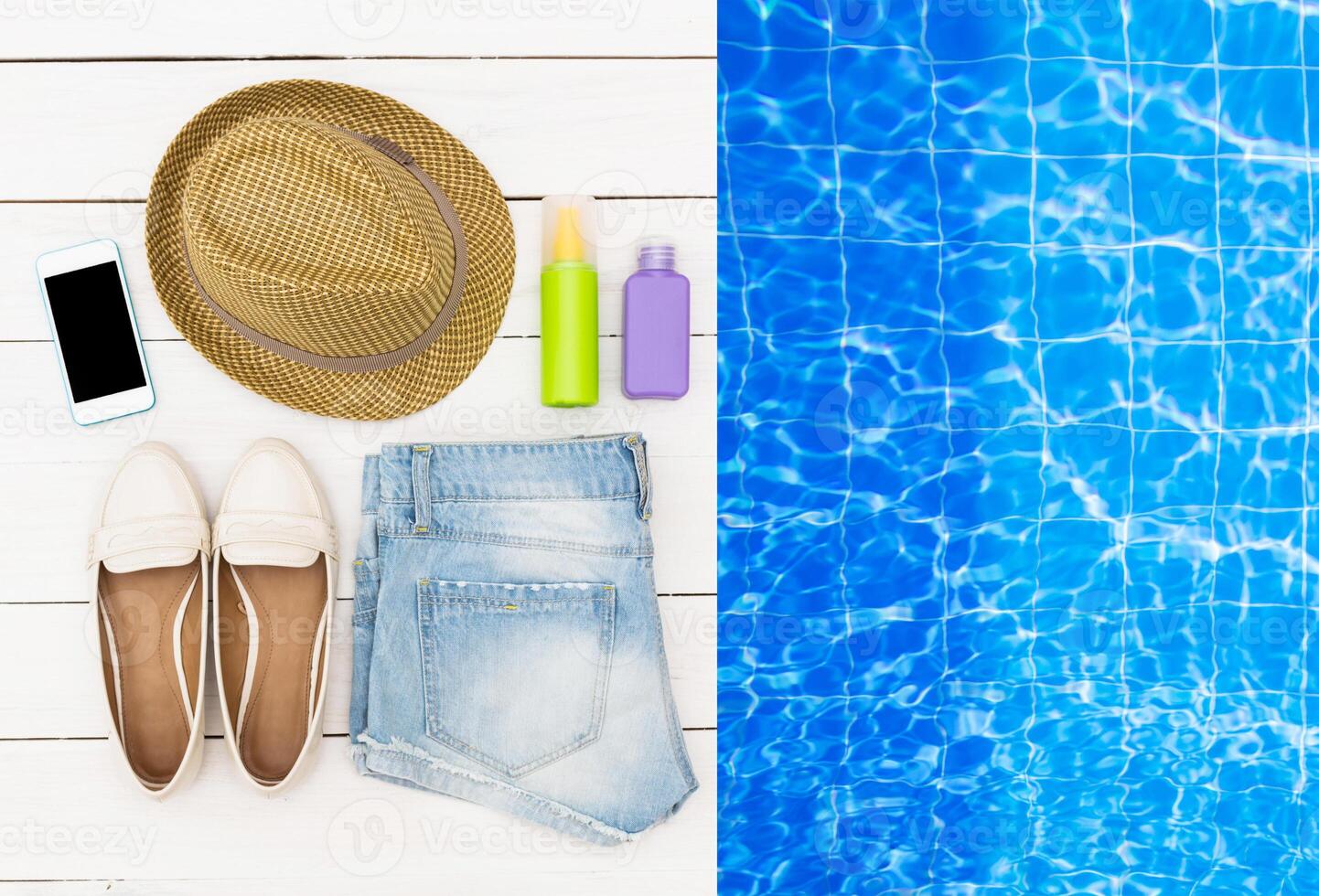 Summer essentials arranged for a fun day by the pool featuring footwear, shorts, sunblock, and a straw hat photo