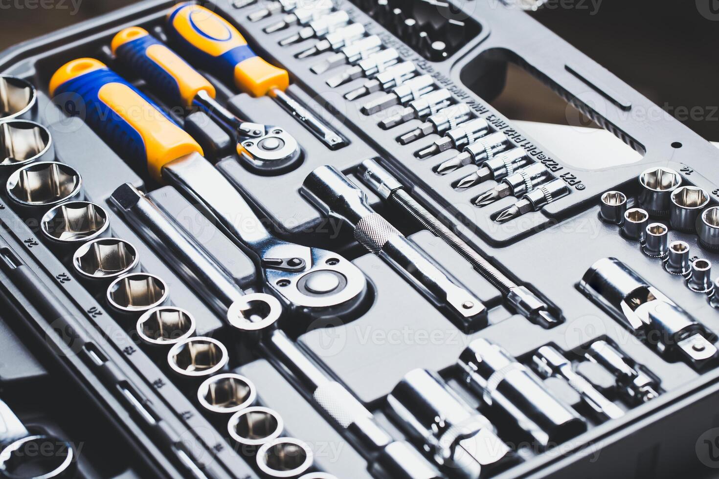 Comprehensive toolset displayed with various sizes of wrenches and sockets arranged neatly in a black case photo