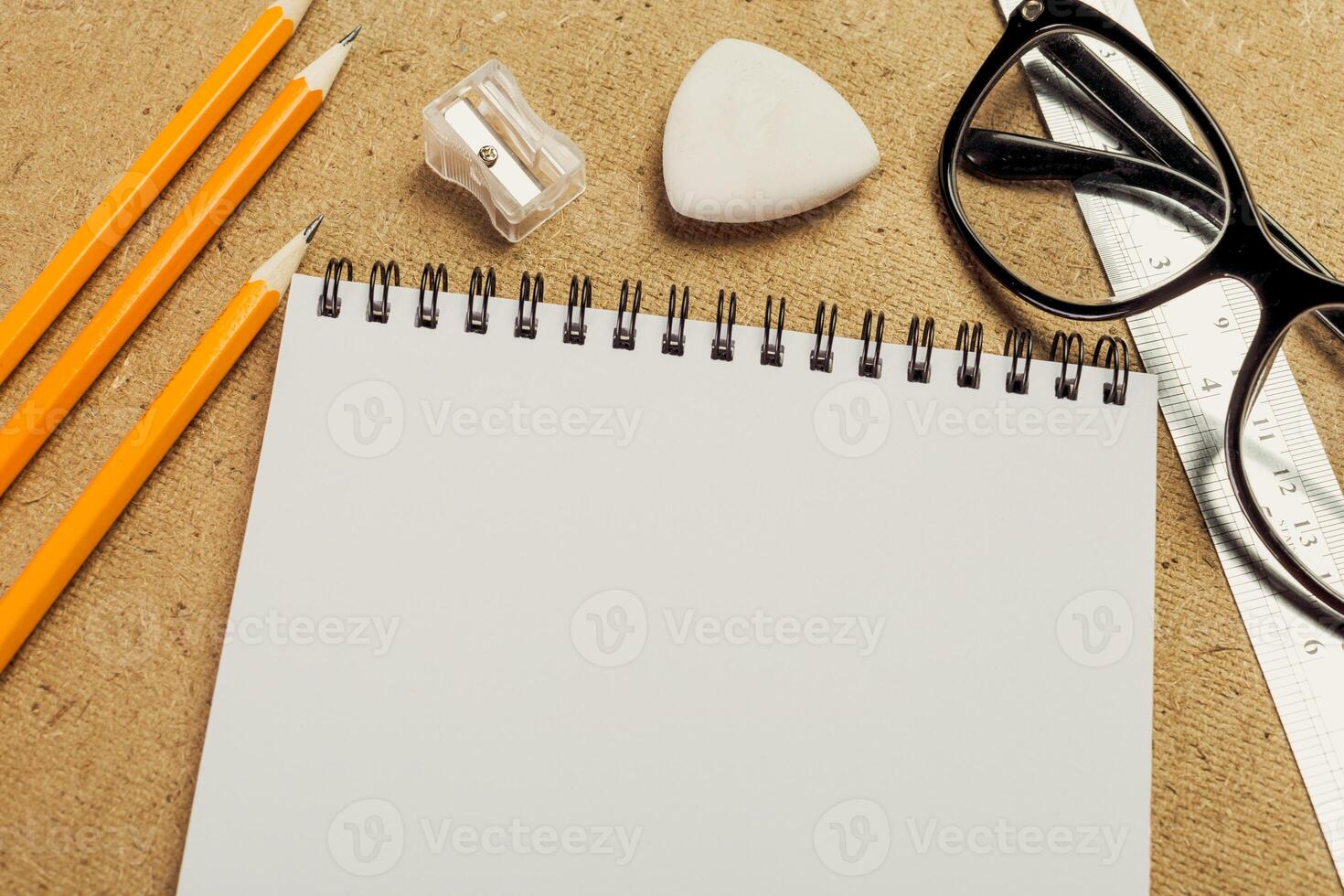 Stationery supplies arranged neatly on a textured surface suitable for creative projects photo