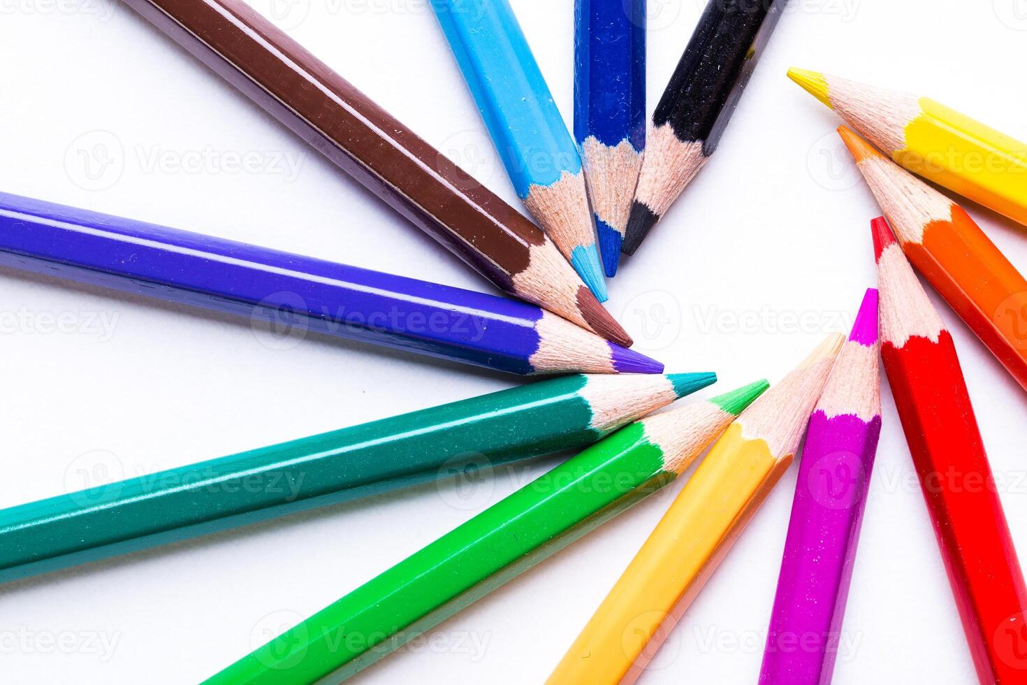 Colorful arrangement of pencils showcasing vibrant hues on a white background in an art setting photo