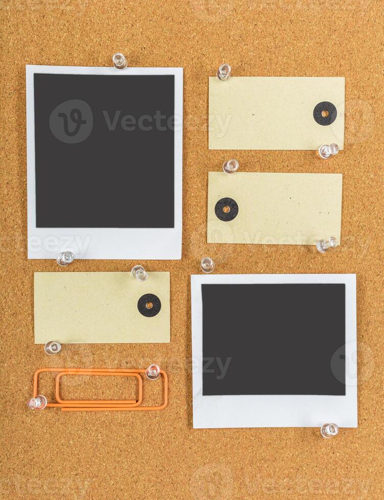 Blank notes and photos pinned on a corkboard displaying creativity and organization in a workspace setting