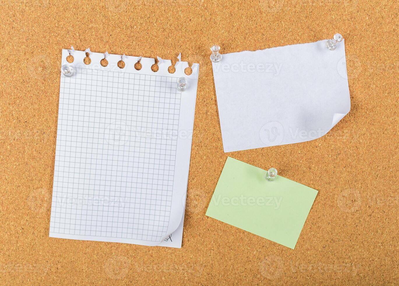 Notes pinned on a corkboard for organization and reminders in a workspace setting photo