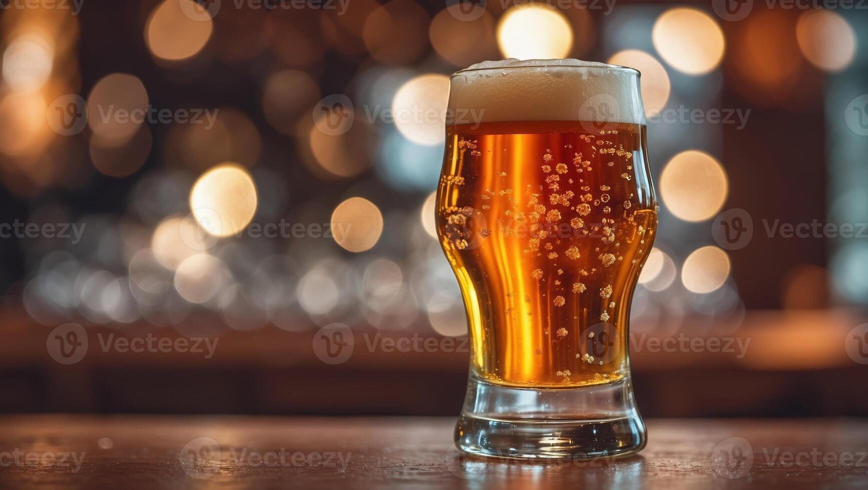 Refreshing cold beer served in a glass with bubbles against a blurred background of lights photo