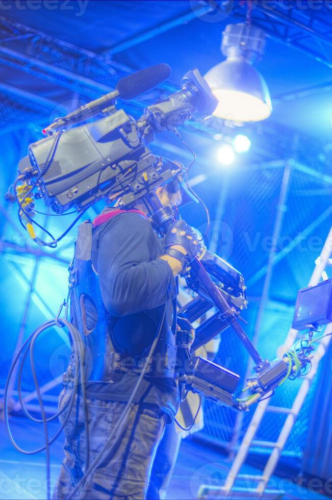 Steadicam operator on the set of a TV show photo